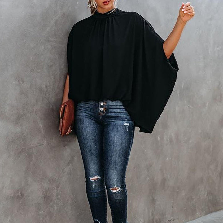 "Damtopp med livfullt tryck, färgglada mönster och dolman ärm för en stilfull och bekväm look, perfekt för alla tillfällen."