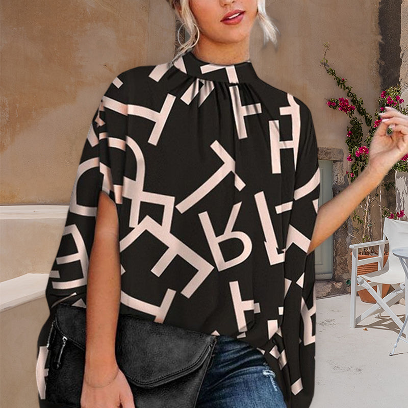 "Damtopp med livfullt tryck, färgglada mönster och dolman ärm för en stilfull och bekväm look, perfekt för alla tillfällen."