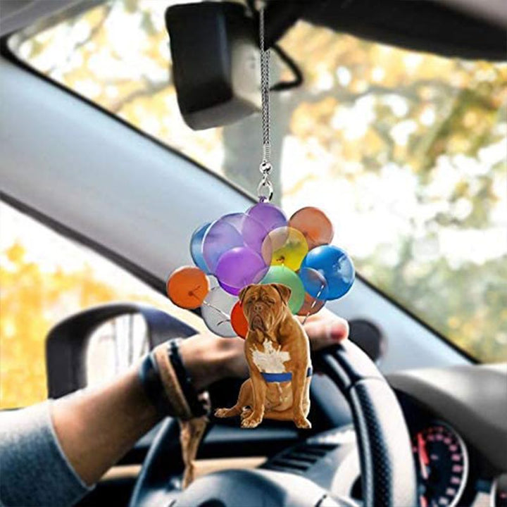 Dekorativ hundbilhänge i glimmerplast, hänger från bilspegeln, ljus och livfull design, ger bil en personlig touch.