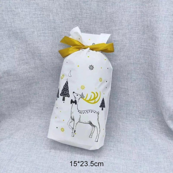 "Dekorativa julklappspåsar med dragsko och festliga motiv, perfekt för snabb och stilfull inpackning av julklappar."