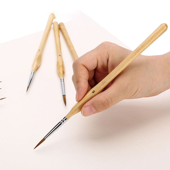 "Detaljpenselsats med 11 precisionsborstar, ergonomiska trähantag, perfekt för konstmålning och modellering."