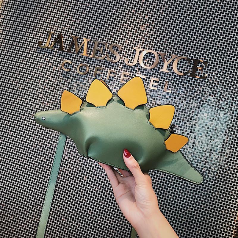 "Dinosaur handväska för damer med justerbar axelrem, lekfull design i PU-läder, från sidan med unik stil."
