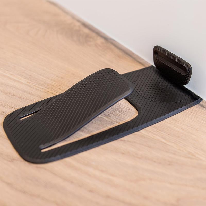 "Dörrstopp för hemanvändning, enkel installation på olika ytor, elegant design, flera färgalternativ."