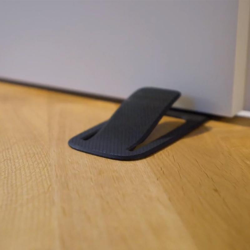 "Dörrstopp för hemanvändning, enkel installation på olika ytor, elegant design, flera färgalternativ."