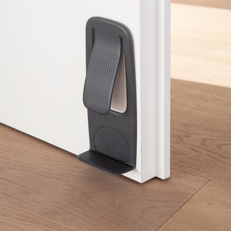 "Dörrstopp för hemanvändning, enkel installation på olika ytor, elegant design, flera färgalternativ."