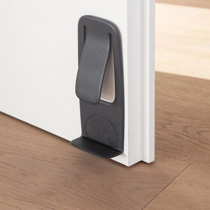 "Dörrstopp för hemanvändning, enkel installation på olika ytor, elegant design, flera färgalternativ."