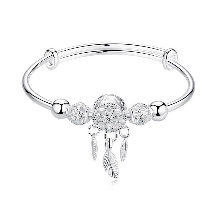 "Dreamcatcher Armband i silver för män och kvinnor, justerbart, med glansig finish och unikt drömfångarmotiv."