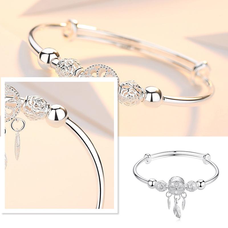 "Dreamcatcher Armband i silver för män och kvinnor, justerbart, med glansig finish och unikt drömfångarmotiv."