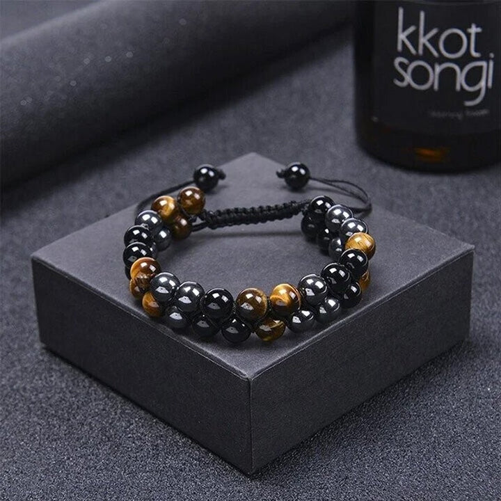 "Dubbel skikt kristallarmband med tigeröga, svart obsidian och hematit för både män och kvinnor, stilrent och elegant."