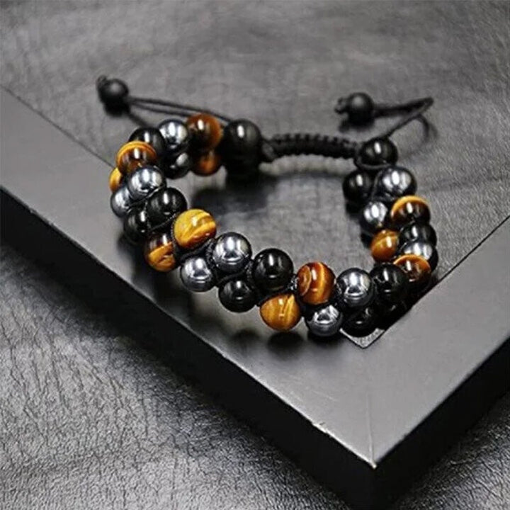 "Dubbel skikt kristallarmband med tigeröga, svart obsidian och hematit för både män och kvinnor, stilrent och elegant."