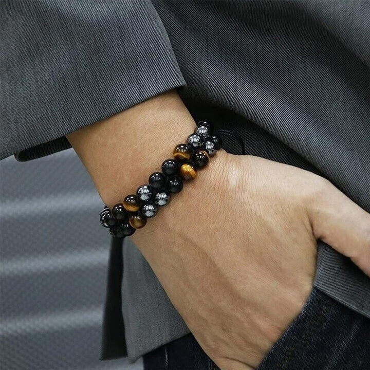 "Dubbel skikt kristallarmband med tigeröga, svart obsidian och hematit för både män och kvinnor, stilrent och elegant."