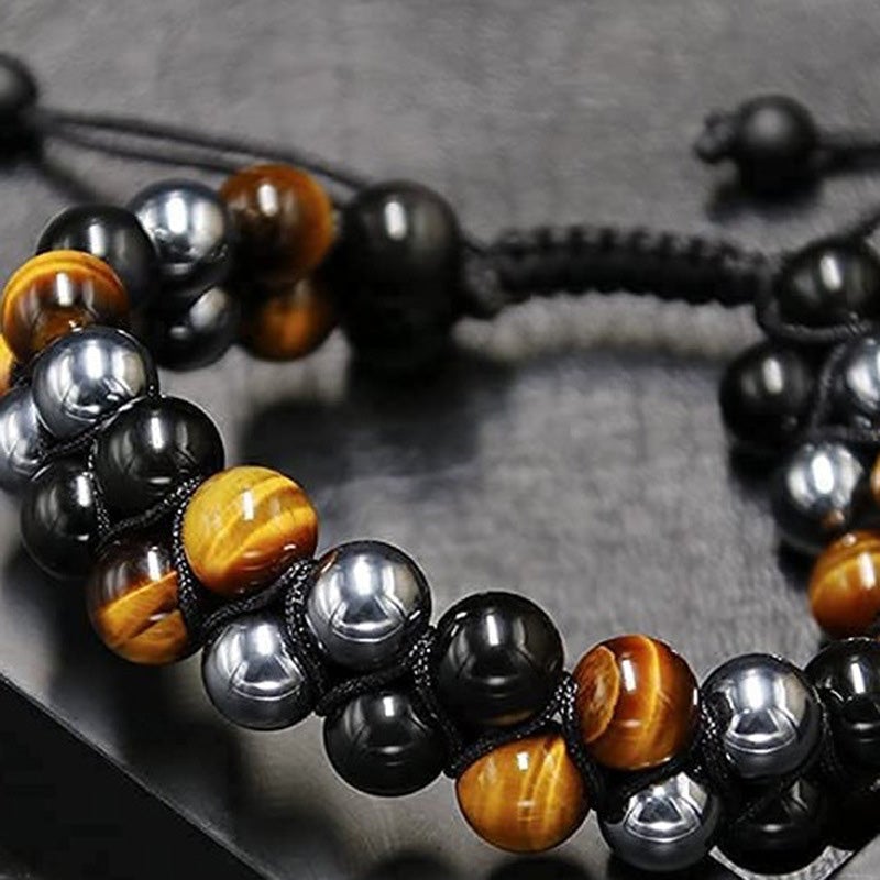 "Dubbel skikt kristallarmband med tigeröga, svart obsidian och hematit för både män och kvinnor, stilrent och elegant."