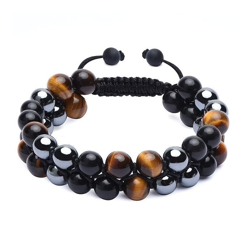 "Dubbel skikt kristallarmband med tigeröga, svart obsidian och hematit för både män och kvinnor, stilrent och elegant."