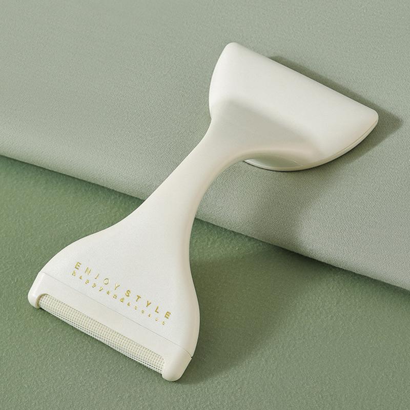 "Dubbelhuvud luddborttagare i grönt visar ergonomisk design och dubbla huvuden för effektiv luddborttagning."