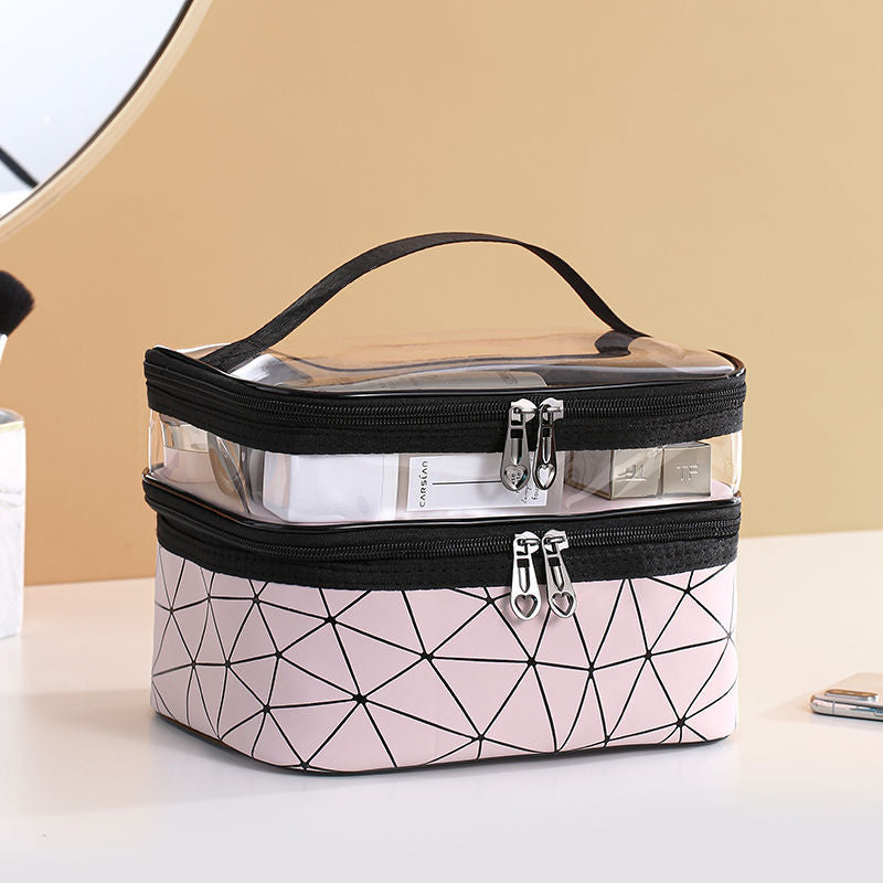 "Dubbellagers kosmetikaväska i transparent TPU med rymligt fack, dubbla dragkedjor och elegant design för sminkförvaring."
