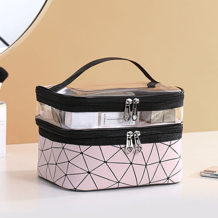 "Dubbellagers kosmetikaväska i transparent TPU med rymligt fack, dubbla dragkedjor och elegant design för sminkförvaring."