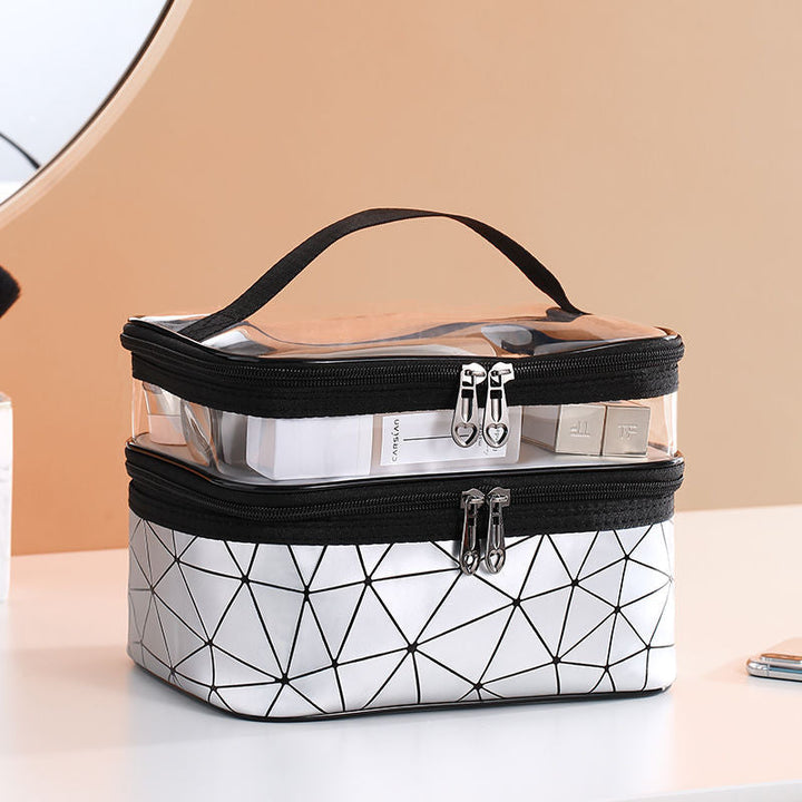 "Dubbellagers kosmetikaväska i transparent TPU med rymligt fack, dubbla dragkedjor och elegant design för sminkförvaring."