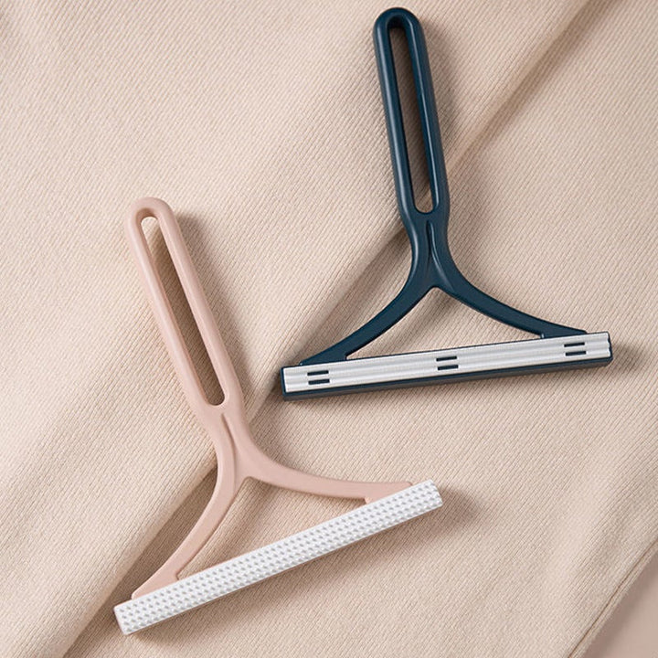 "Dubbelsidig manuell hårborttagningsapparat för kläder med ergonomiskt Y-handtag, silikonborste, grön, blå och rosa."
