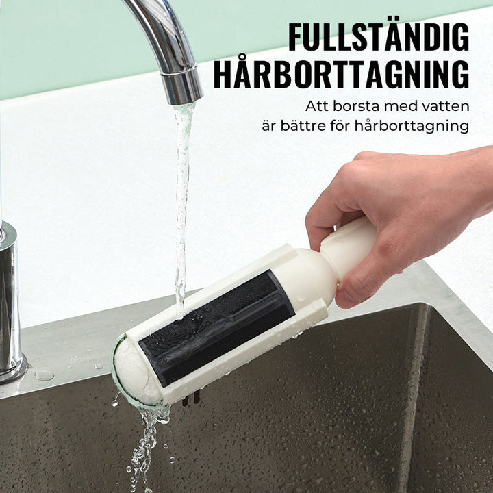 "Effektiv husdjurshårborttagningsrulle i röd färg med ergonomiskt grepp, perfekt för att hålla möbler och kläder pälsfria."