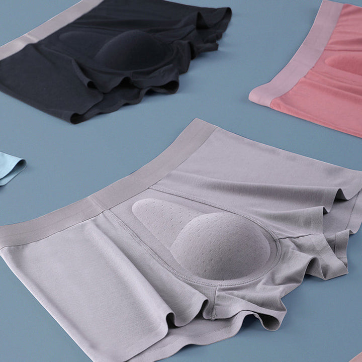 "Ekologiska bomullsboxershorts för män i svart, grå och blå, med stödpaneler för komfort och modern stil."