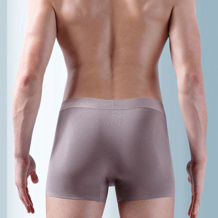 "Ekologiska bomullsboxershorts för män i svart, grå och blå, med stödpaneler för komfort och modern stil."