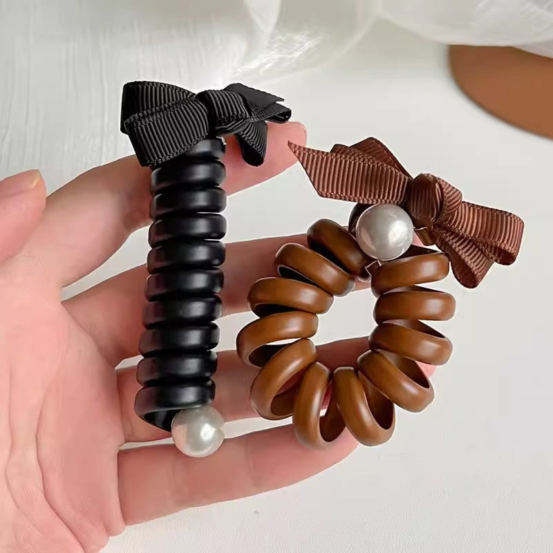"Elastiskt bowknot hårband för kvinnor, flätad design, flera färger, praktiskt och elegant till vardagsfrisyrer."