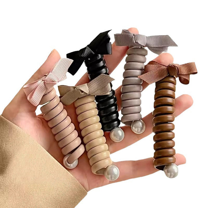 "Elastiskt bowknot hårband för kvinnor, flätad design, flera färger, praktiskt och elegant till vardagsfrisyrer."