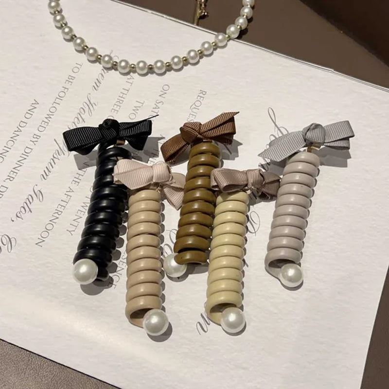 "Elastiskt bowknot hårband för kvinnor, flätad design, flera färger, praktiskt och elegant till vardagsfrisyrer."