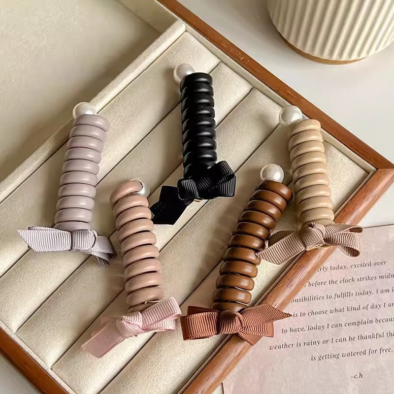 "Elastiskt bowknot hårband för kvinnor, flätad design, flera färger, praktiskt och elegant till vardagsfrisyrer."