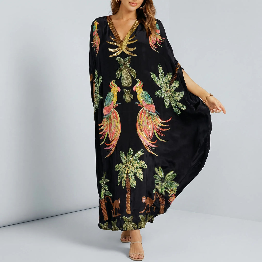 Bekväm lös passform ankellång damkaftan med tropiskt mönster, idealisk för semester och strand.