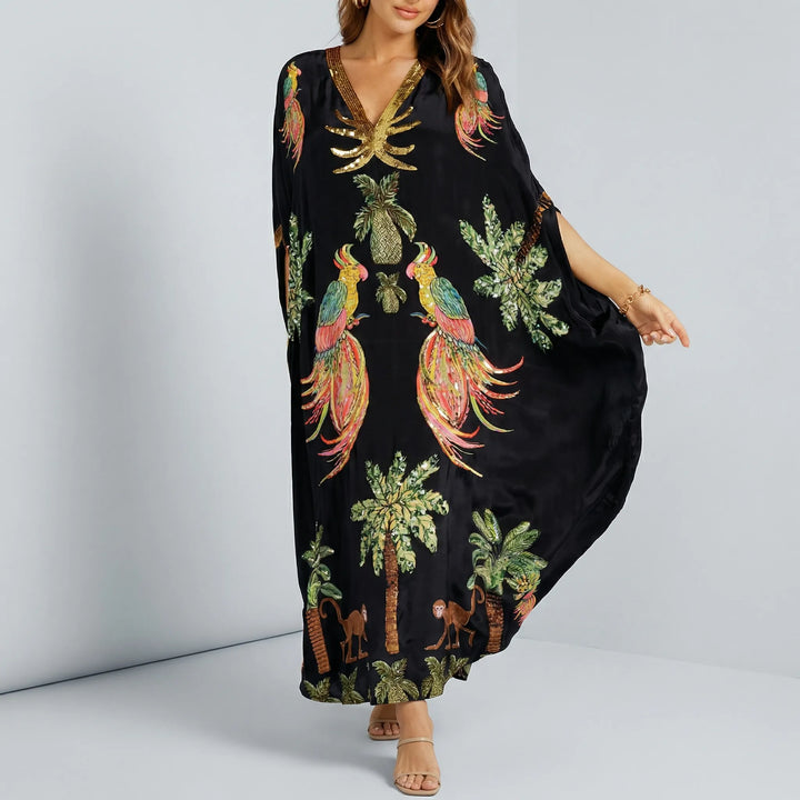 Bekväm lös passform ankellång damkaftan med tropiskt mönster, idealisk för semester och strand.