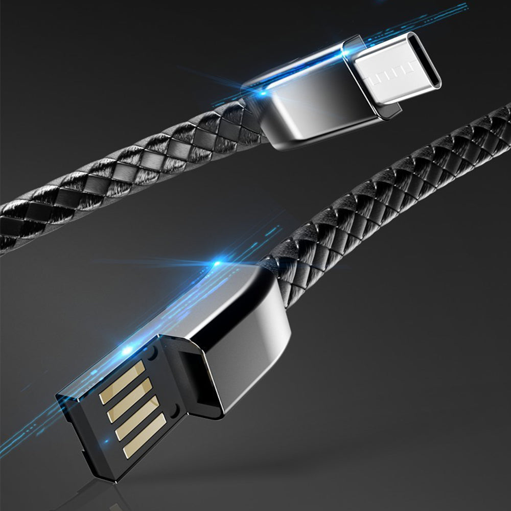 "Elegant armband i svart PU-läder med integrerad laddningskabel, perfekt för modern stil och funktionalitet."