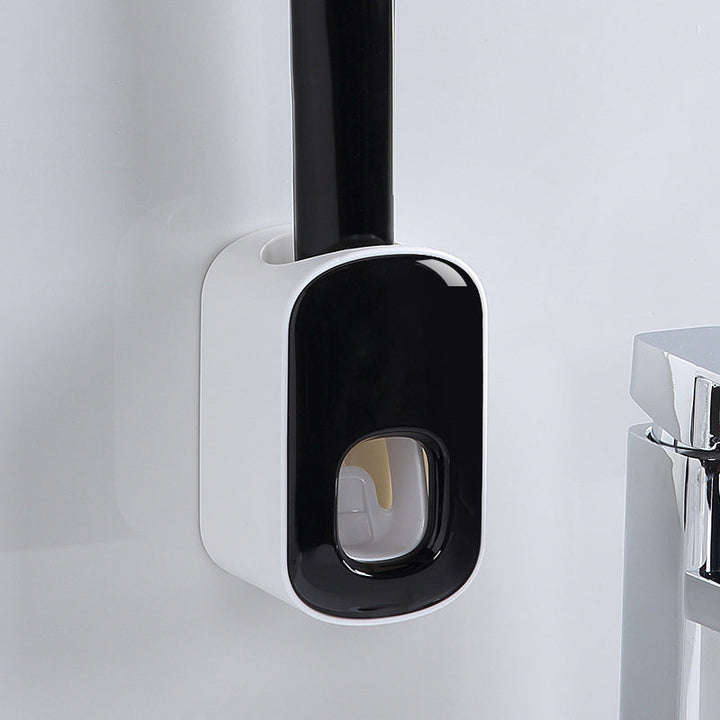"Elegant automatisk tandkrämsklämma i modern design, sparar tid i badrummet, monteras enkelt på släta ytor."