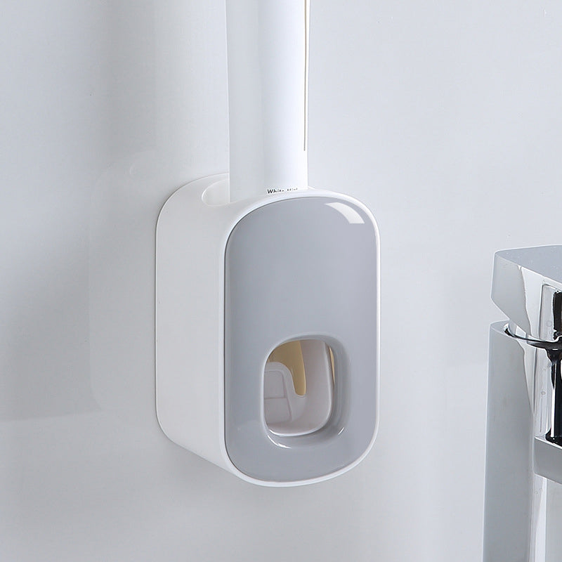"Elegant automatisk tandkrämsklämma i modern design, sparar tid i badrummet, monteras enkelt på släta ytor."