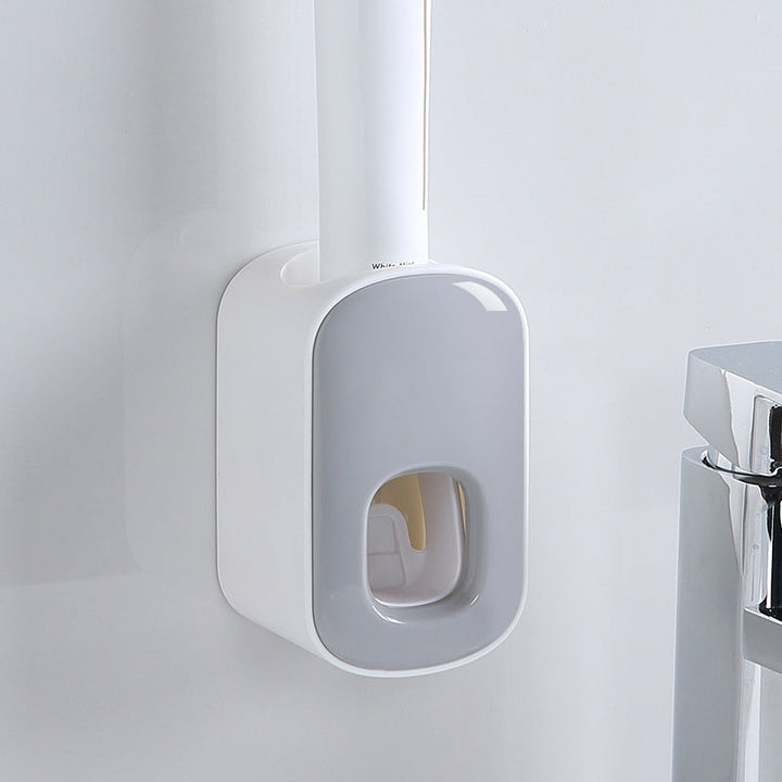 "Elegant automatisk tandkrämsklämma i modern design, sparar tid i badrummet, monteras enkelt på släta ytor."