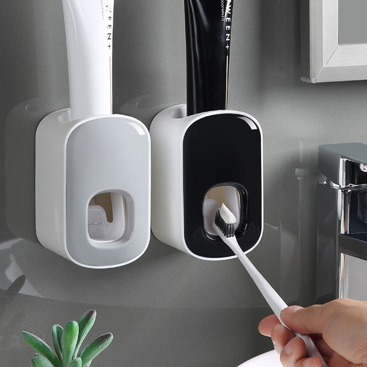 "Elegant automatisk tandkrämsklämma i modern design, sparar tid i badrummet, monteras enkelt på släta ytor."