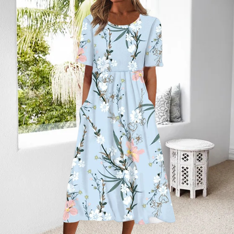 "Elegant blommig A-linje klänning med rund hals i vitt och blått, midi-längd för en feminin och sofistikerad stil."