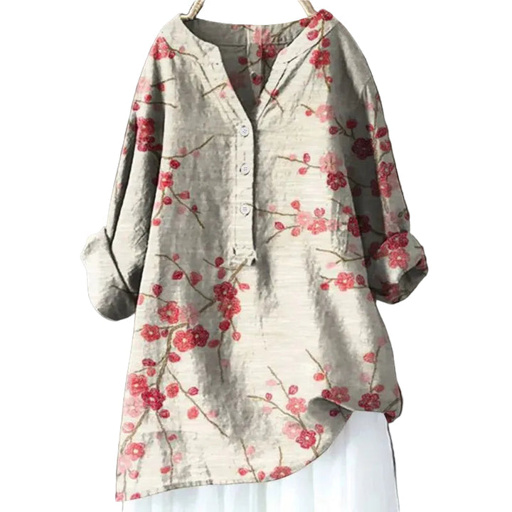 Elegant blommig blus för kvinnor med flödande design, perfekt för både vardag och fest