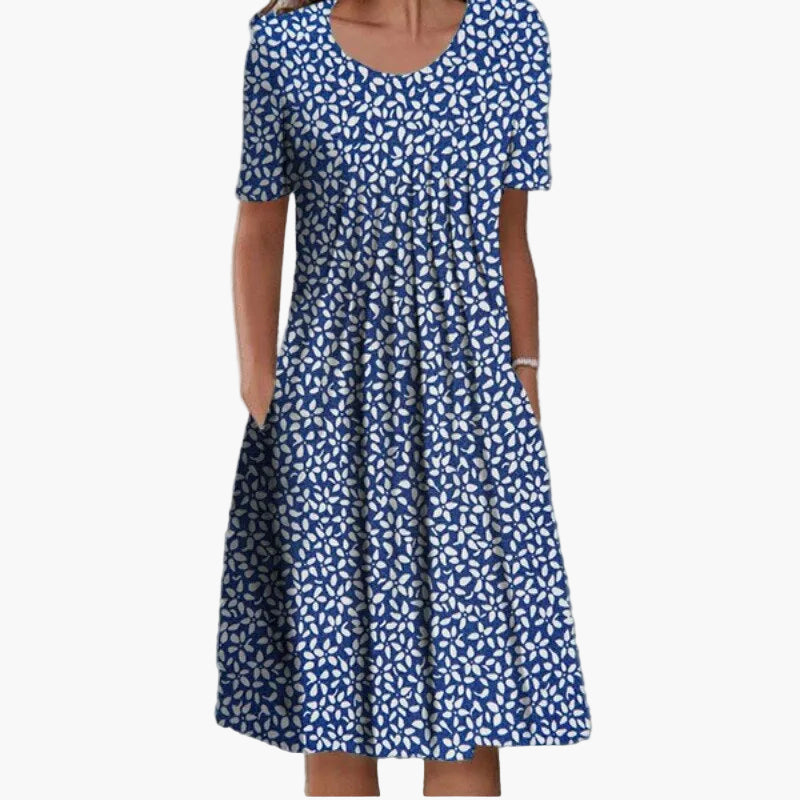 Blommig elegant dam sommarklänning, idealisk som vardagsklänning eller festklänning. Perfekt semesterklänning.