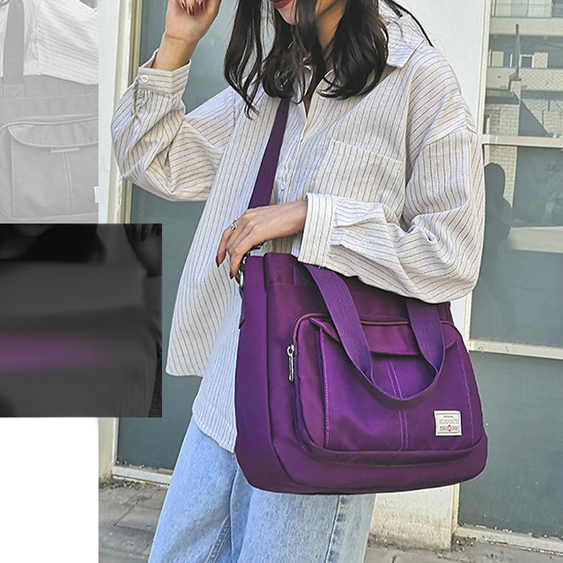 "Elegant crossbody-handväska i nylon för damer, svart och slitstark, kan bäras som axelväska, justerbar rem."