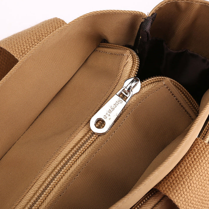 "Elegant crossbody-handväska i nylon för damer, svart och slitstark, kan bäras som axelväska, justerbar rem."