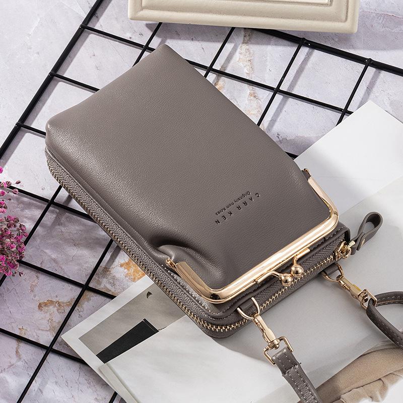 "Elegant crossbody kurirväska i PU-läder för kvinnor med justerbar rem, flerrumsdesign, finns i flera färger."