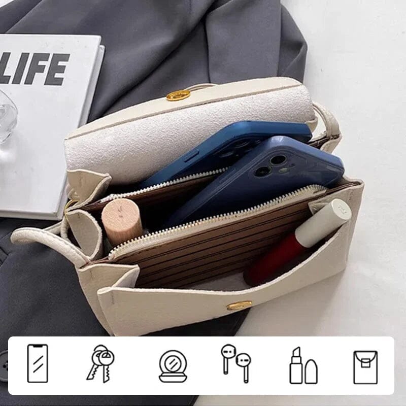 "Elegant crossbody-väska för kvinnor i PU-läder med elefanthänge, säker dragkedja, vit och compact med rymliga fack."
