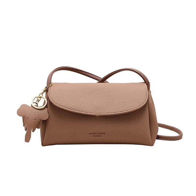 "Elegant crossbody-väska för kvinnor i PU-läder med elefanthänge, säker dragkedja, vit och compact med rymliga fack."