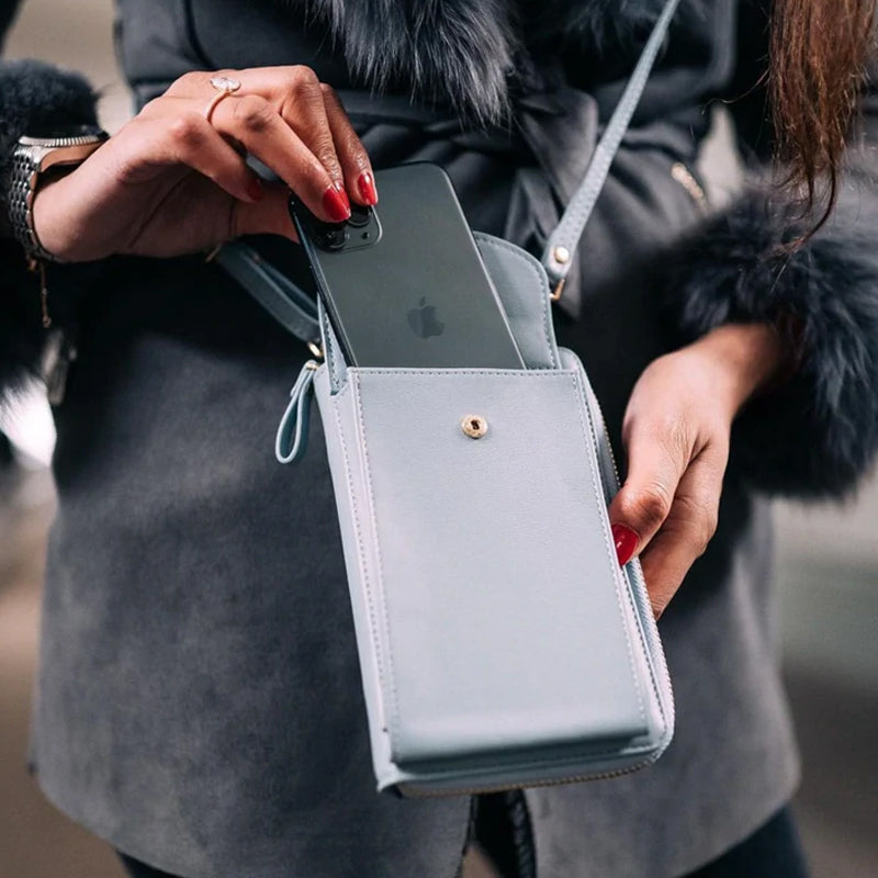"Elegant dam crossbody telefonväska i rött PU-läder med avtagbar rem, rymligt fack för värdesaker, mångsidig design."