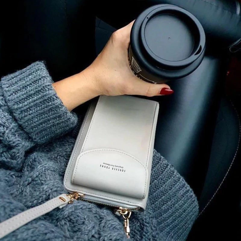 "Elegant dam crossbody telefonväska i rött PU-läder med avtagbar rem, rymligt fack för värdesaker, mångsidig design."