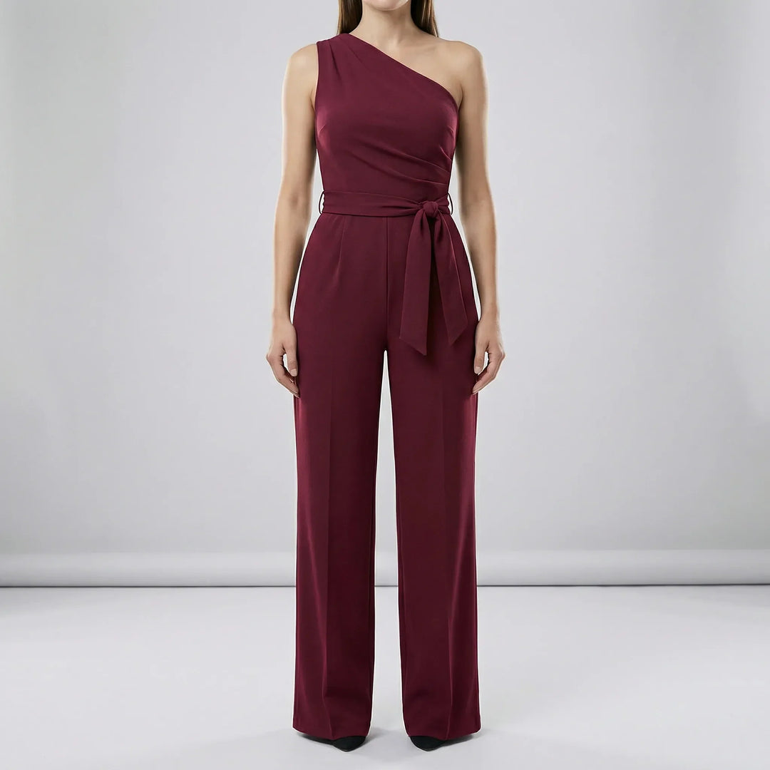Enaxlad dam jumpsuit med knytskärp som accentuerar midjan. Bekväm och elegant för en sofistikerad look.