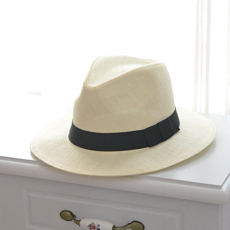 "Elegant dam solhatt med stort brätte, naturlig halm, beige/white, erbjuder utmärkt solskydd, sommaraccessoar."