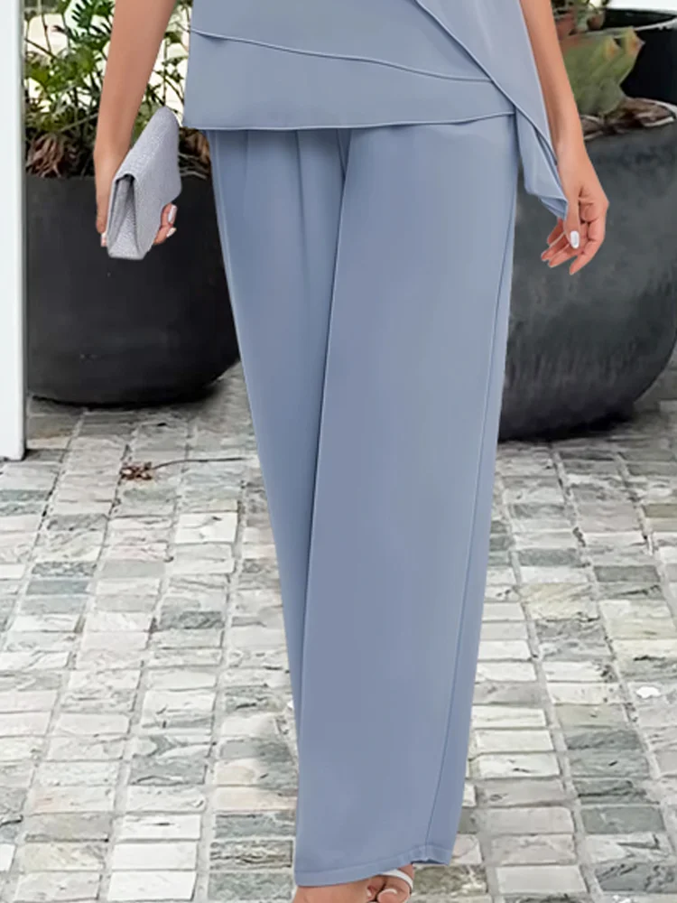 Marinblått och ljusblått dam sommar tvådelat set med elegant topp och byxor för festliga tillfällen.