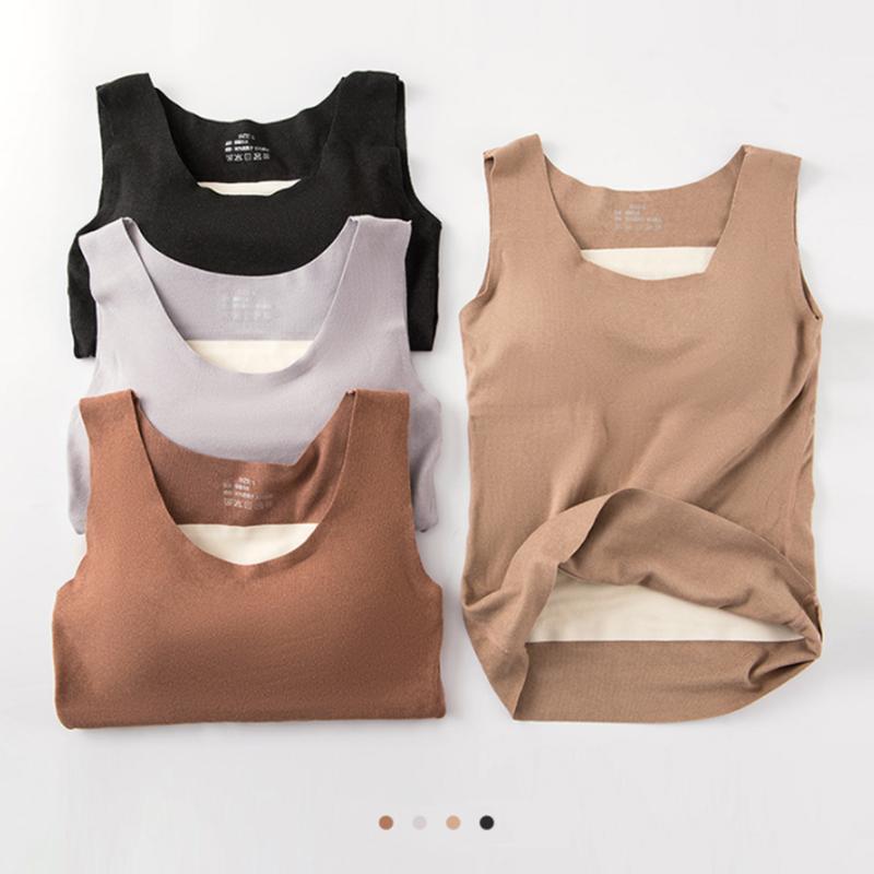 Elegant dam termisk fleeceväst i grå färg, stilren design med högvärmande och andningsbart material, perfekt för kalla dagar.